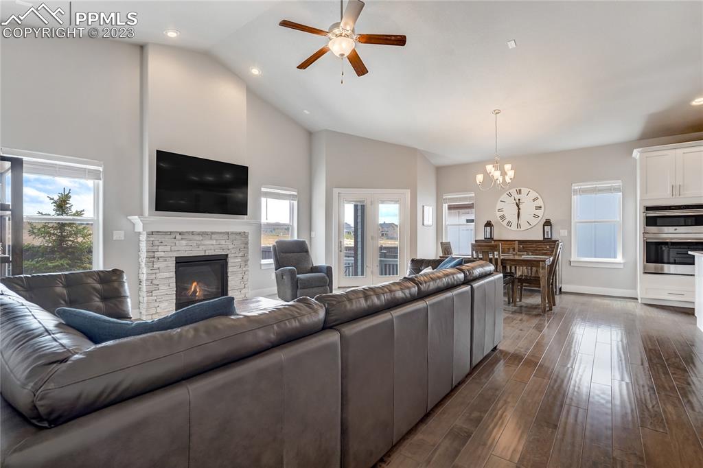 11590 Spectacular Bid Circle Colorado Springs, CO 80921 - Photo 9 of 49 a living room with furniture fireplace and flat screen tv