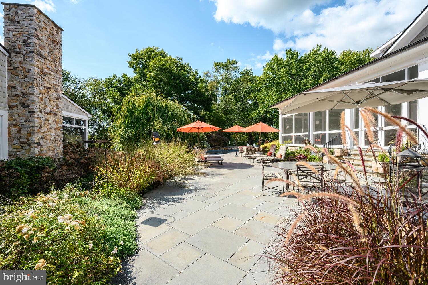 7508 Cooper Point Road Bozman, MD 21612 - Photo 22 of 116 Blue stone patio with built-in outdoor kitchen