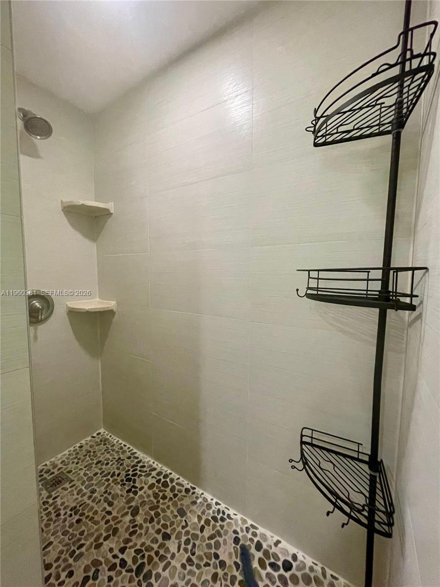 700 Northeast 63rd Street, Unit D203 Miami, FL 33138 - Photo 20 of 36 a bathroom with a shower