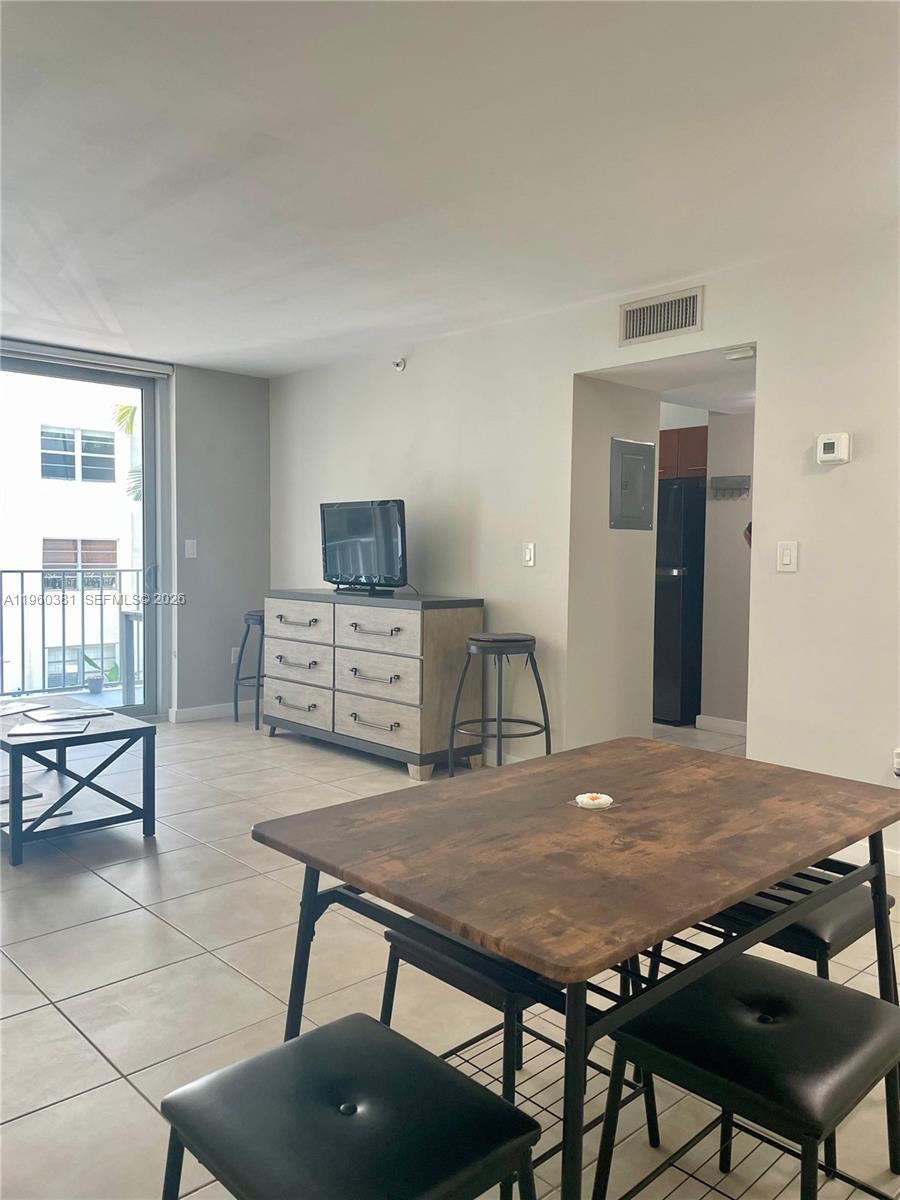 700 Northeast 63rd Street, Unit D203 Miami, FL 33138 - Photo 9 of 36 a view of a dining room with furniture