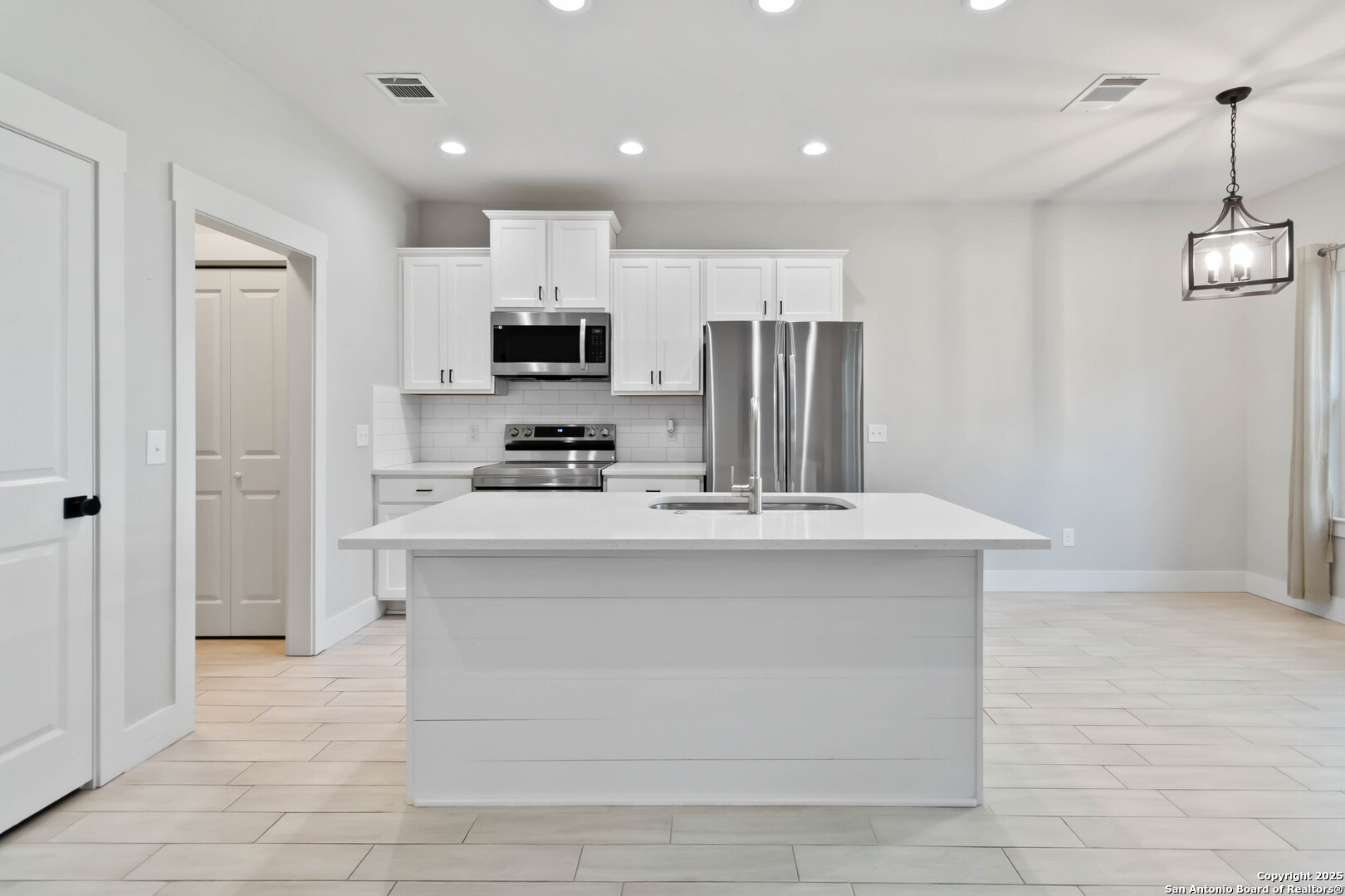 119 Rockingshire Court Spring Branch, TX 78070 - Photo 6 of 34 a kitchen with stainless steel appliances a refrigerator sink and microwave