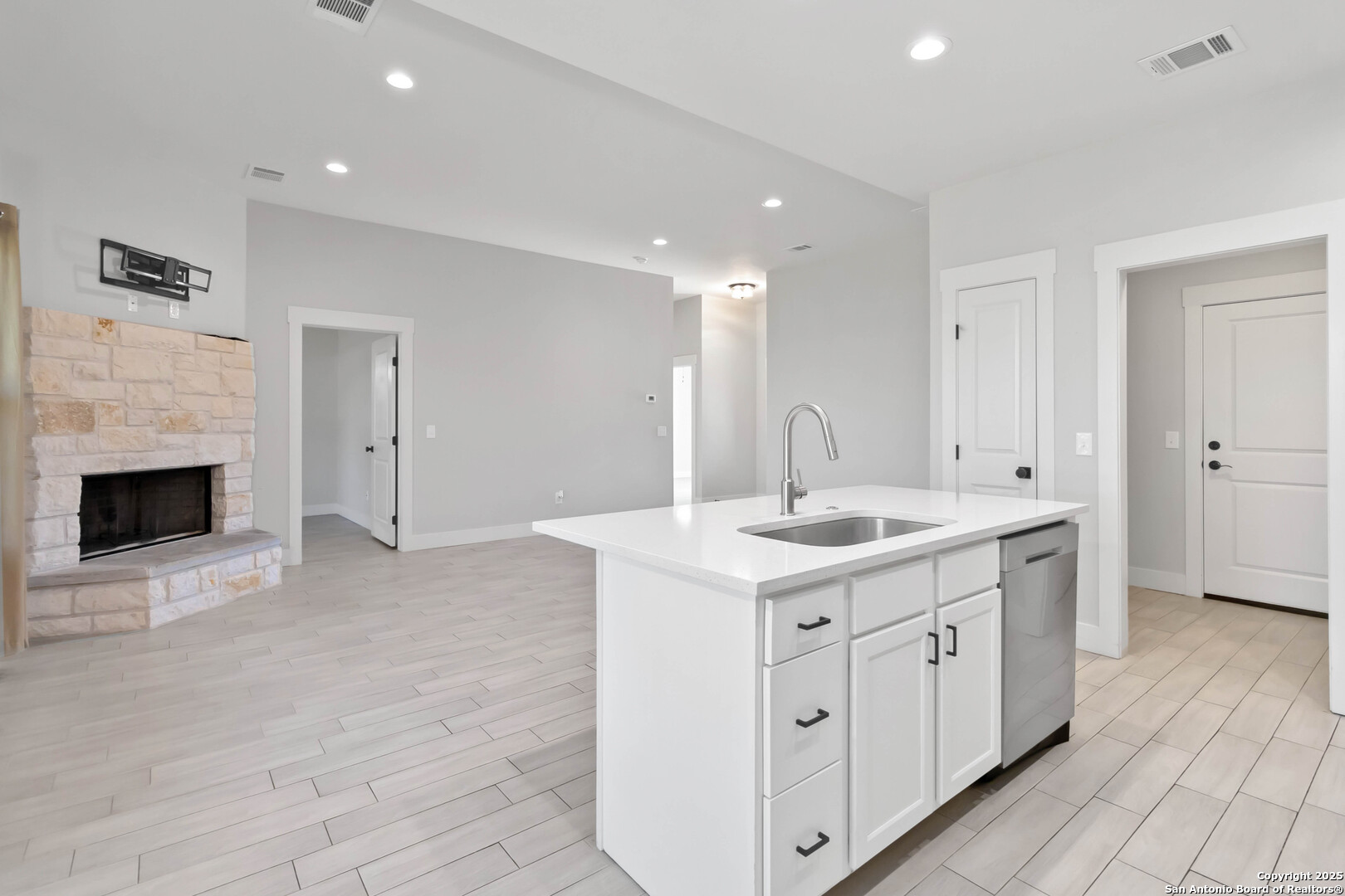 119 Rockingshire Court Spring Branch, TX 78070 - Photo 8 of 34 a kitchen with a sink stove and cabinets