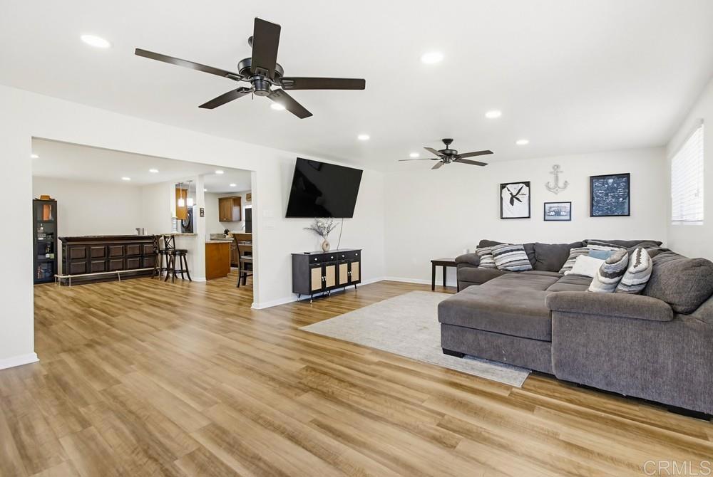 8838 Innsdale Avenue Spring Valley, CA 91977 - Photo 15 of 38 a living room with furniture and a flat screen tv