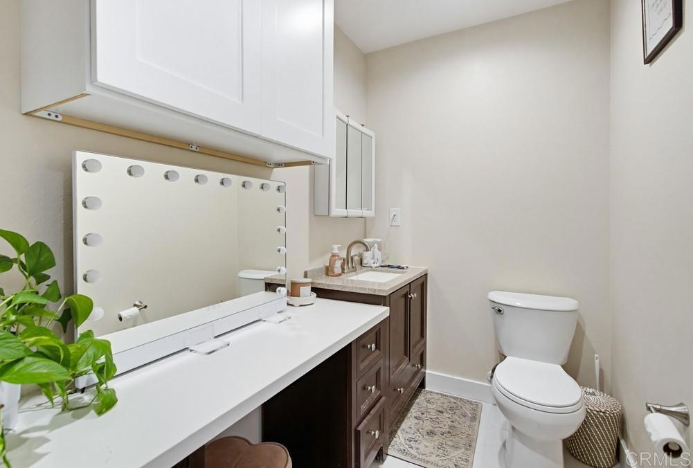 8838 Innsdale Avenue Spring Valley, CA 91977 - Photo 23 of 38 a bathroom with a sink a toilet and a mirror