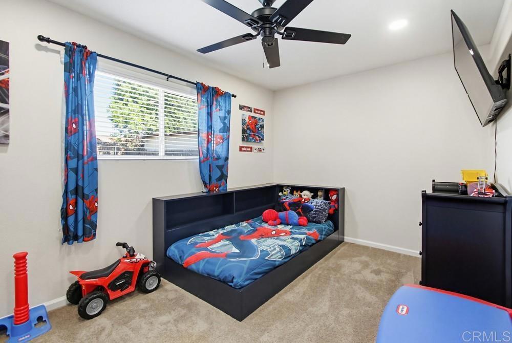8838 Innsdale Avenue Spring Valley, CA 91977 - Photo 25 of 38 a living room with furniture and a flat screen tv