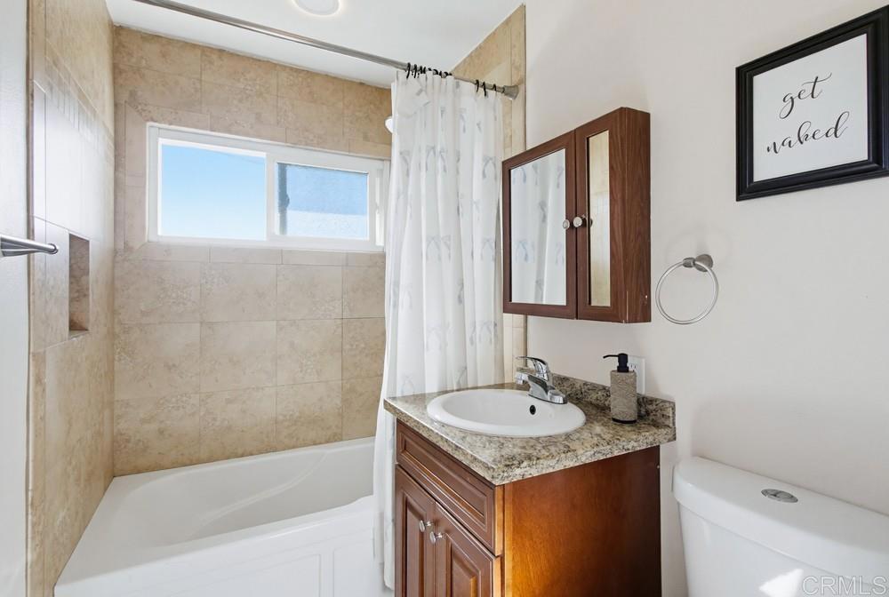 8838 Innsdale Avenue Spring Valley, CA 91977 - Photo 26 of 38 a bathroom with a granite countertop sink toilet and shower