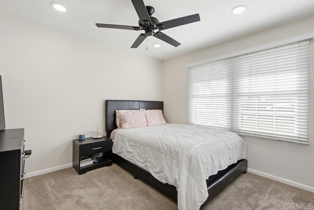 8838 Innsdale Avenue Spring Valley, CA 91977 - Photo 27 of 38 a bedroom with a bed and a ceiling fan