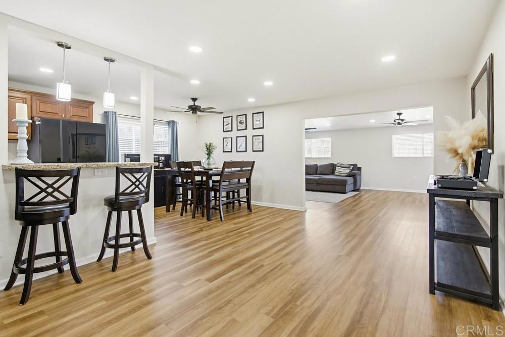 8838 Innsdale Avenue Spring Valley, CA 91977 - Photo 5 of 38 a view of a dining room with furniture and wooden floor
