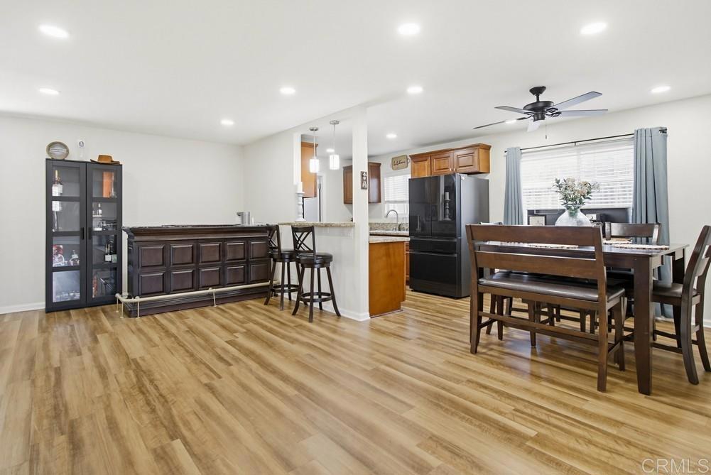 8838 Innsdale Avenue Spring Valley, CA 91977 - Photo 7 of 38 a view of a kitchen with dining room wooden floor and windows