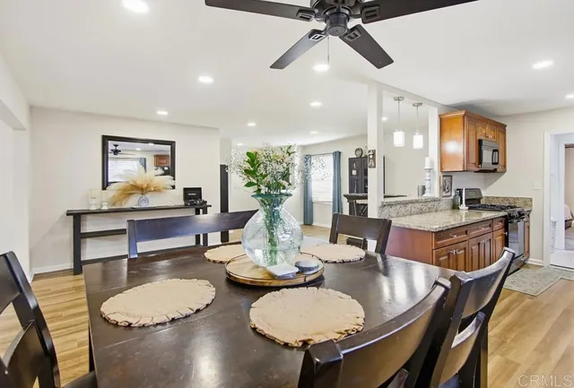 a view of a dining room with furniture and a livingroom