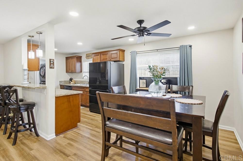 8838 Innsdale Avenue Spring Valley, CA 91977 - Photo 9 of 38 a view of a dining room with furniture window and wooden floor