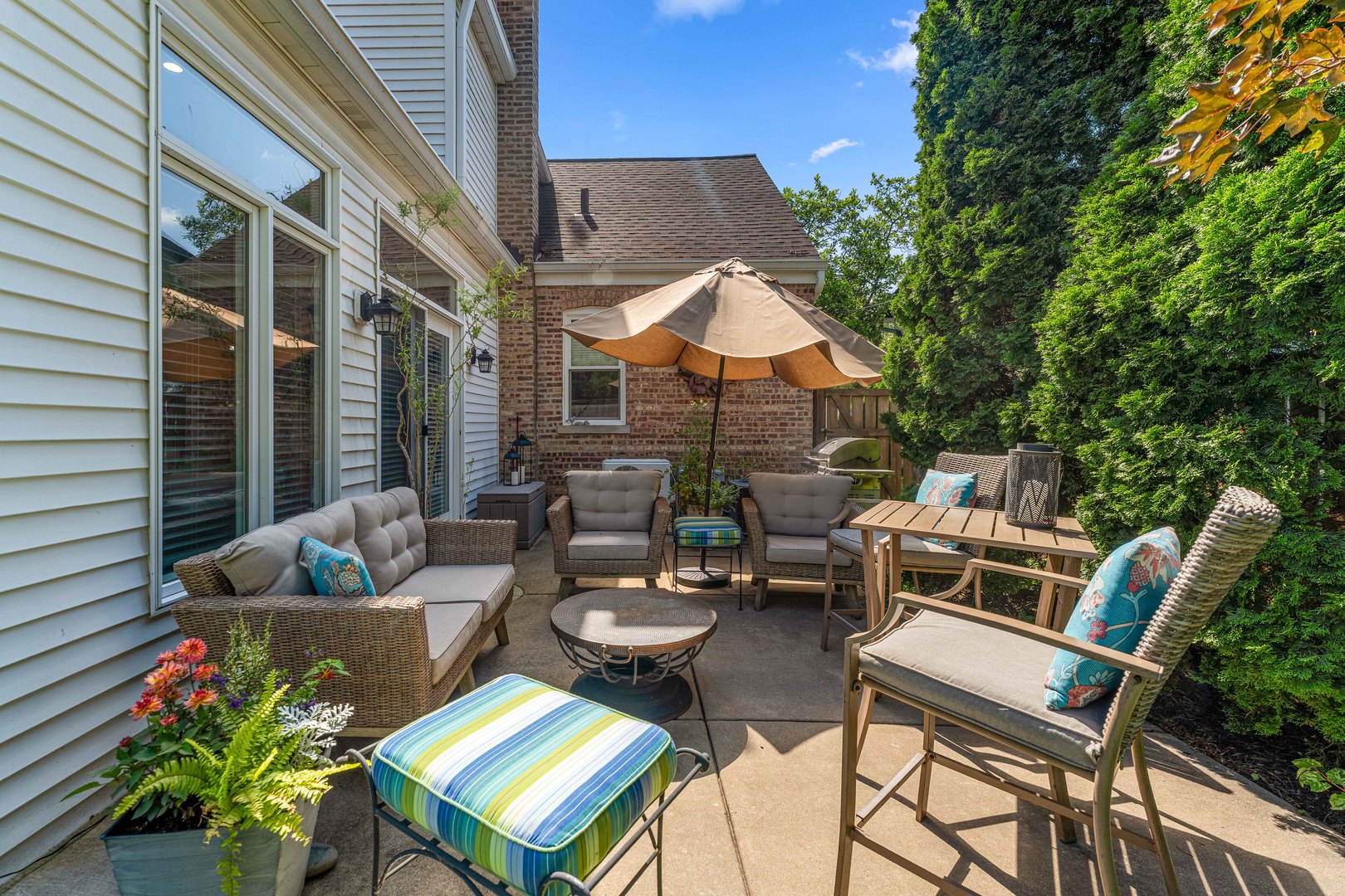 725 North County Line Road Hinsdale, IL 60521 - Photo 23 of 34 a view of a patio with couches chairs and a potted plant