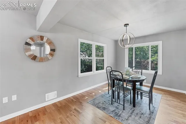 a view of a dining room with furniture window and outside view