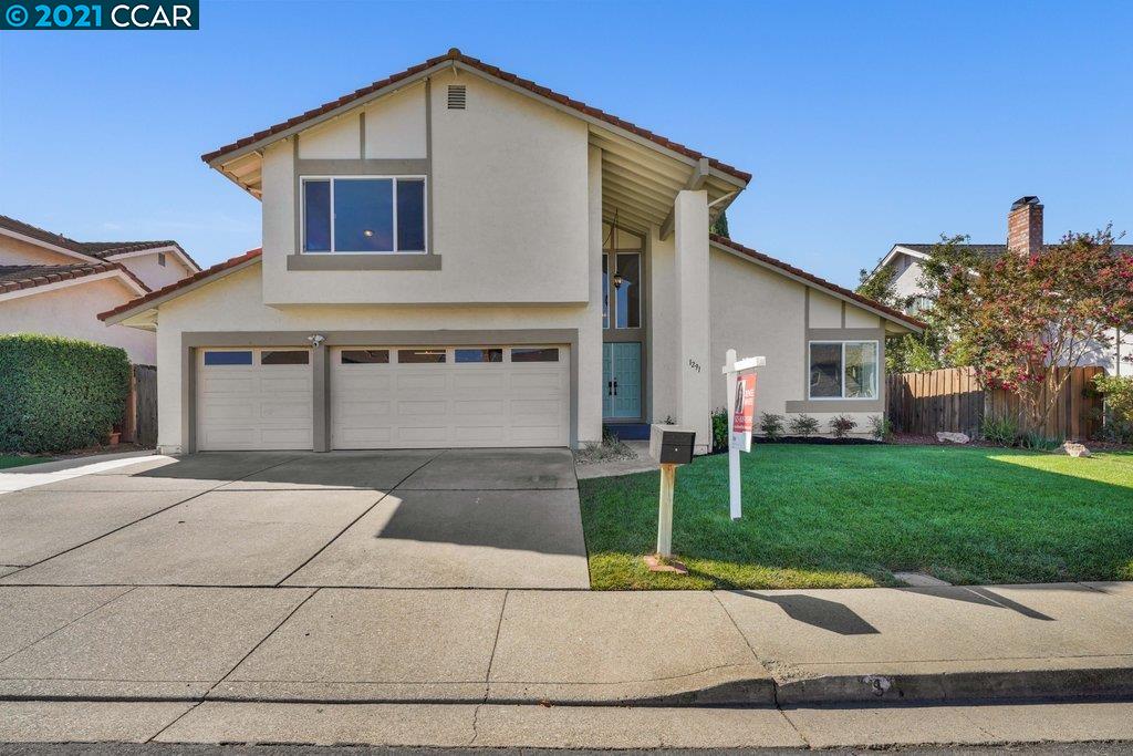 1291 Waterfall Way Concord, CA 94521 - Photo 1 of 1 a front view of a house with a yard and garage