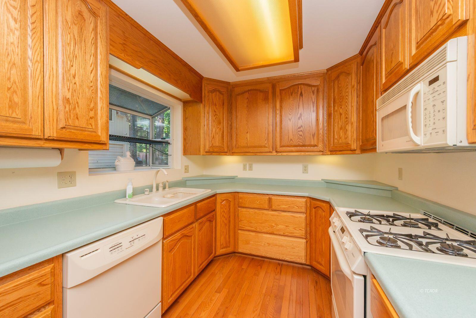 220-230 Lakeview Drive Trinity Center, CA 96091 - Photo 15 of 48 a kitchen with stainless steel appliances granite countertop a sink a stove and cabinets