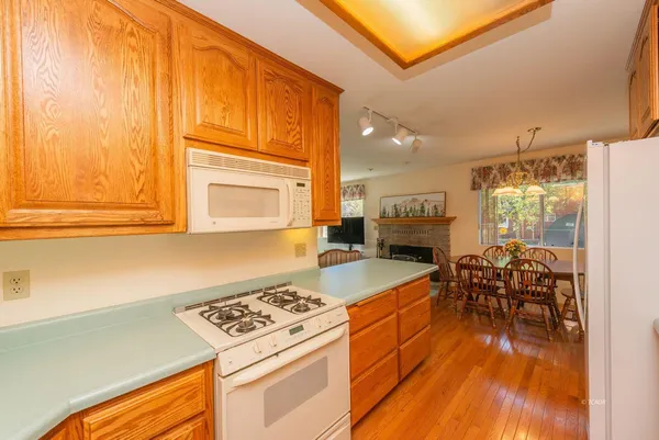 a kitchen with a stove and a refrigerator