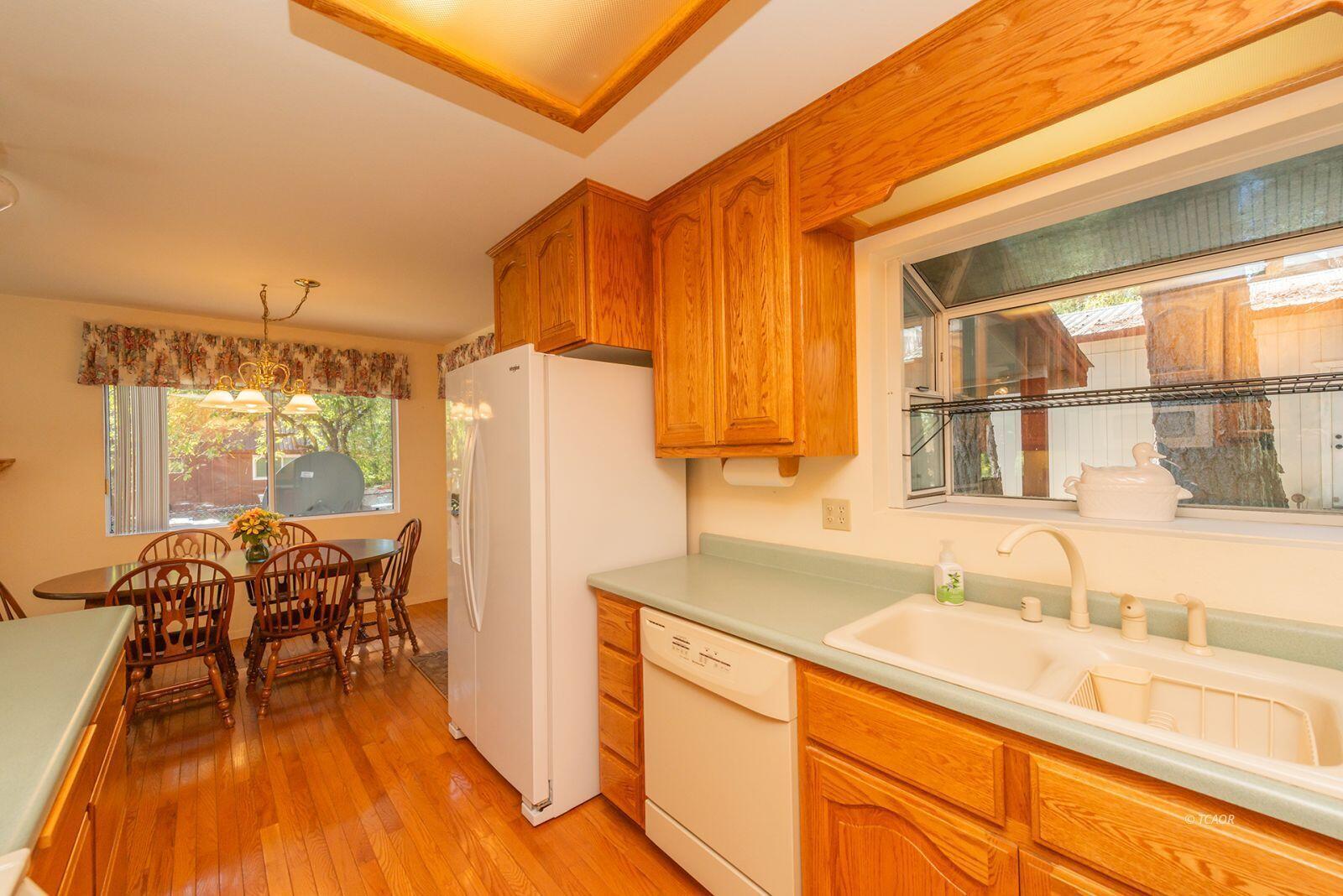 220-230 Lakeview Drive Trinity Center, CA 96091 - Photo 18 of 48 a view of a kitchen with a table and chairs