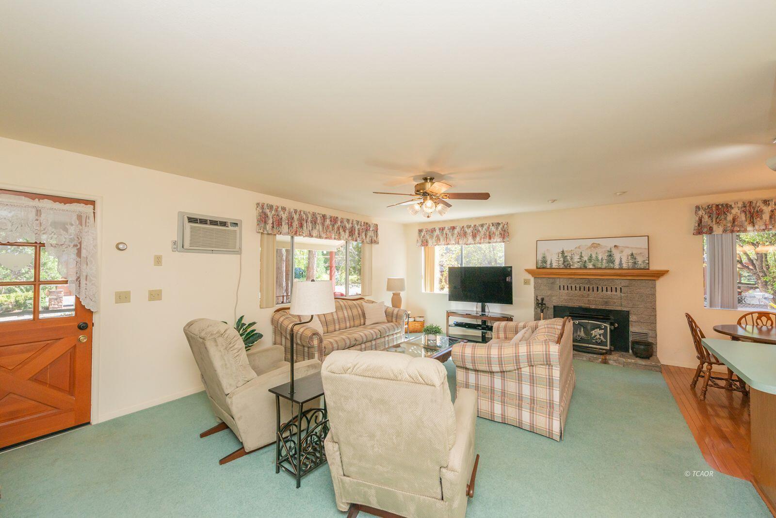 220-230 Lakeview Drive Trinity Center, CA 96091 - Photo 19 of 48 a living room with fireplace furniture and a flat screen tv