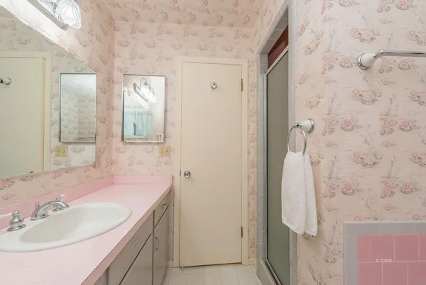 a bathroom with a sink and a mirror