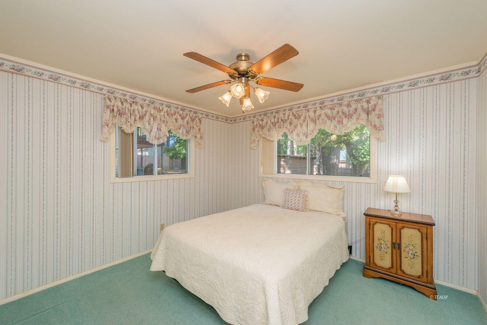 220-230 Lakeview Drive Trinity Center, CA 96091 - Photo 25 of 48 a bedroom with a bed and a window