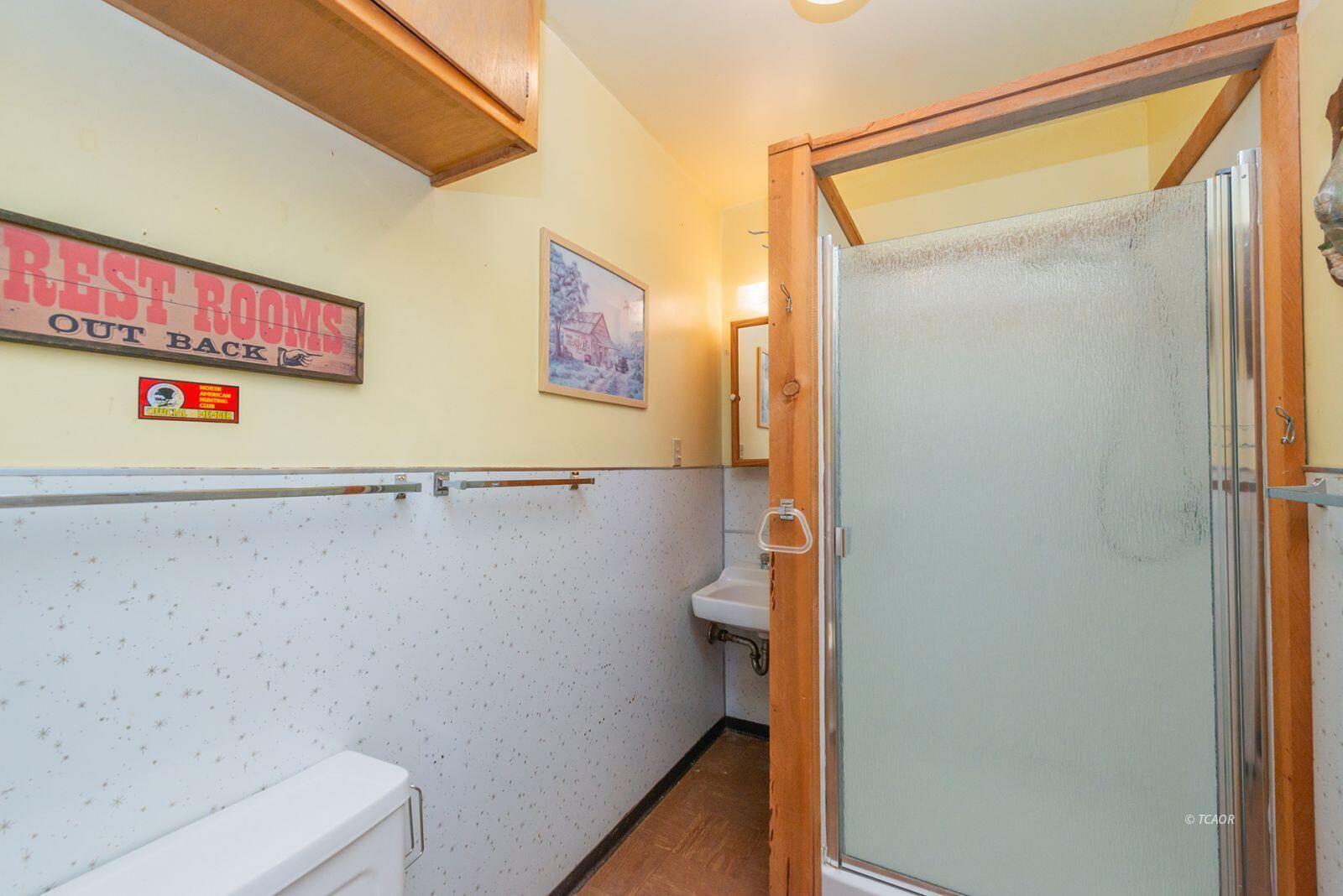 220-230 Lakeview Drive Trinity Center, CA 96091 - Photo 31 of 48 a bathroom with a shower and a toilet