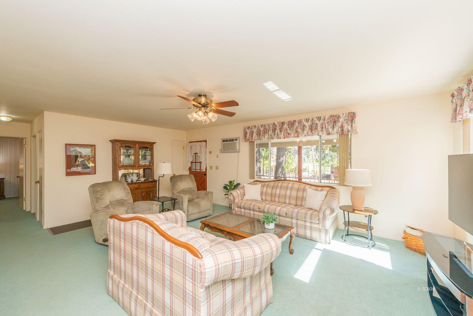 220-230 Lakeview Drive Trinity Center, CA 96091 - Photo 5 of 48 a living room with furniture and a flat screen tv