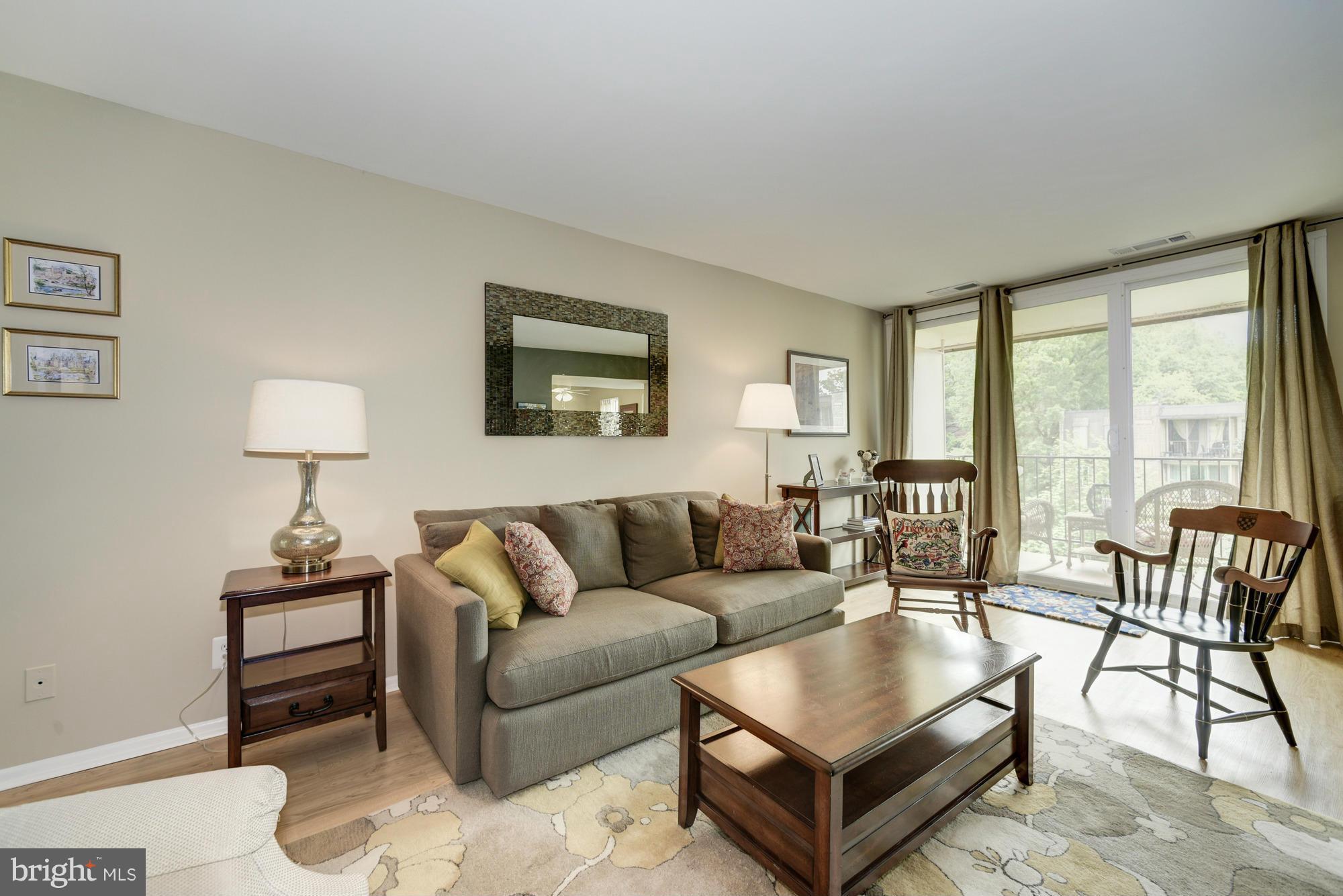 5001 7th Road South, Unit 302 Arlington, VA 22204 - Photo 2 of 30 a living room with furniture and a large window