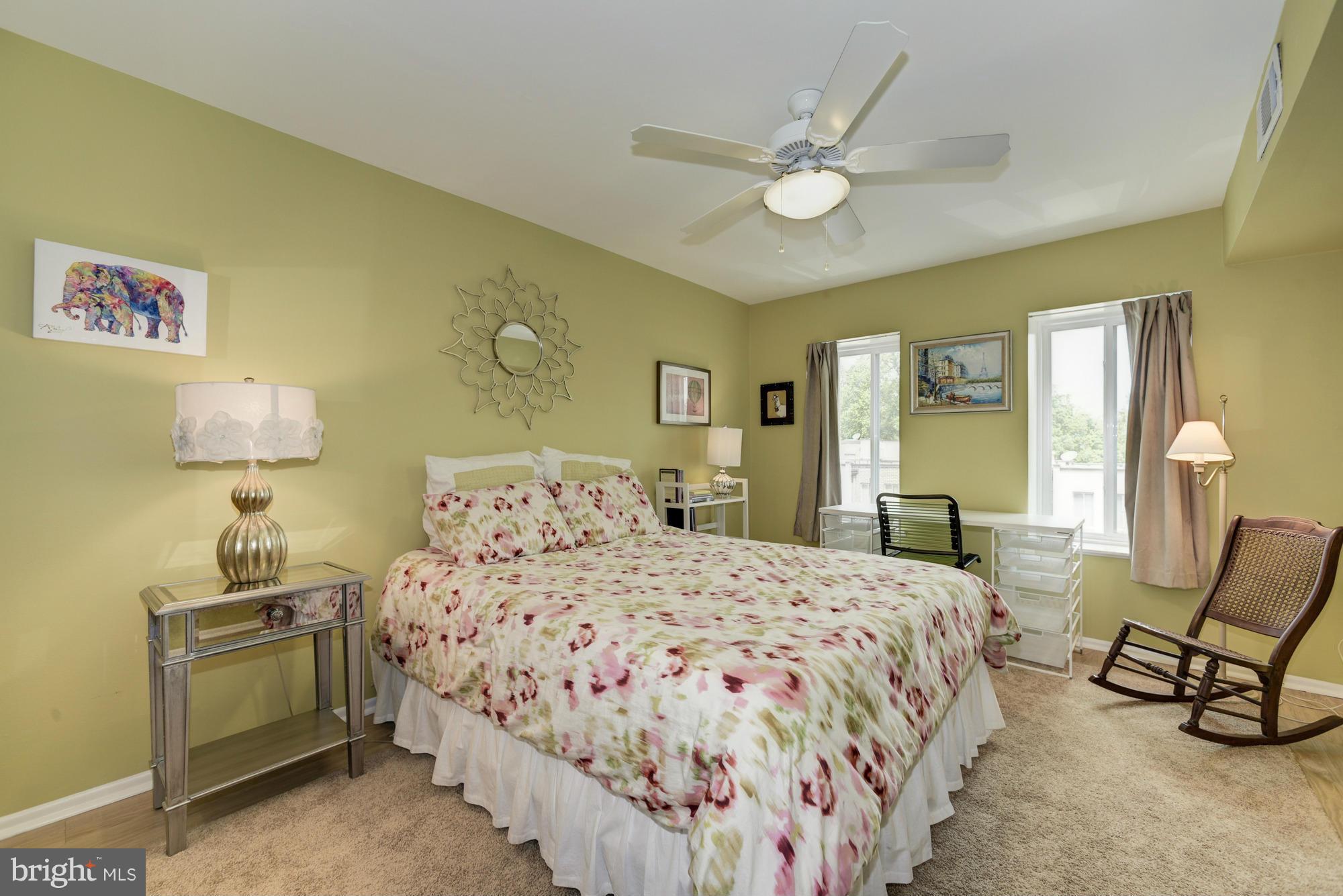 5001 7th Road South, Unit 302 Arlington, VA 22204 - Photo 13 of 30 a bedroom with a bed and a chandelier