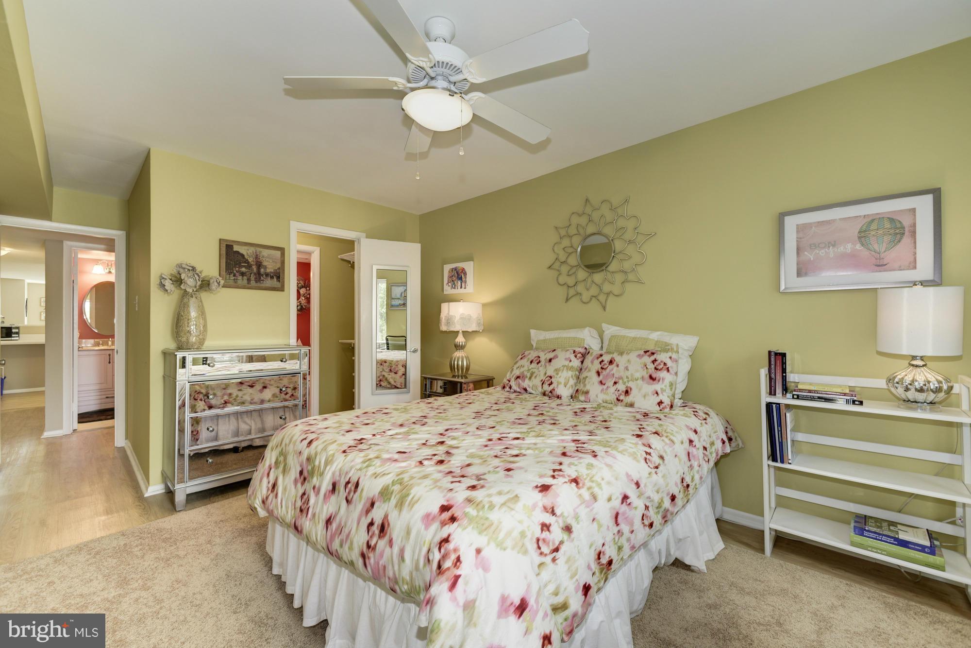 5001 7th Road South, Unit 302 Arlington, VA 22204 - Photo 14 of 30 a bedroom with a bed and a chandelier