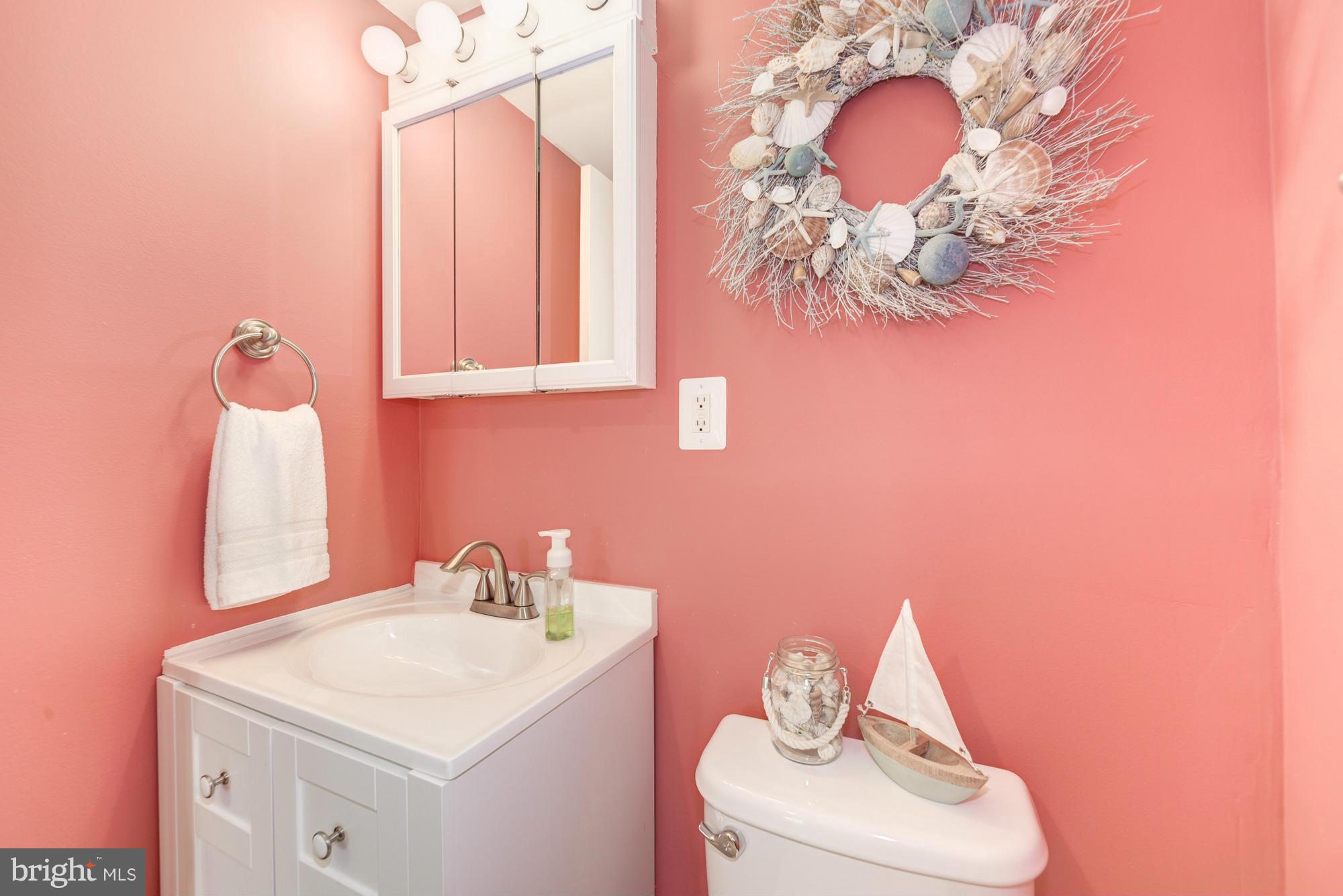 5001 7th Road South, Unit 302 Arlington, VA 22204 - Photo 16 of 30 a bathroom with a sink a mirror and a toilet
