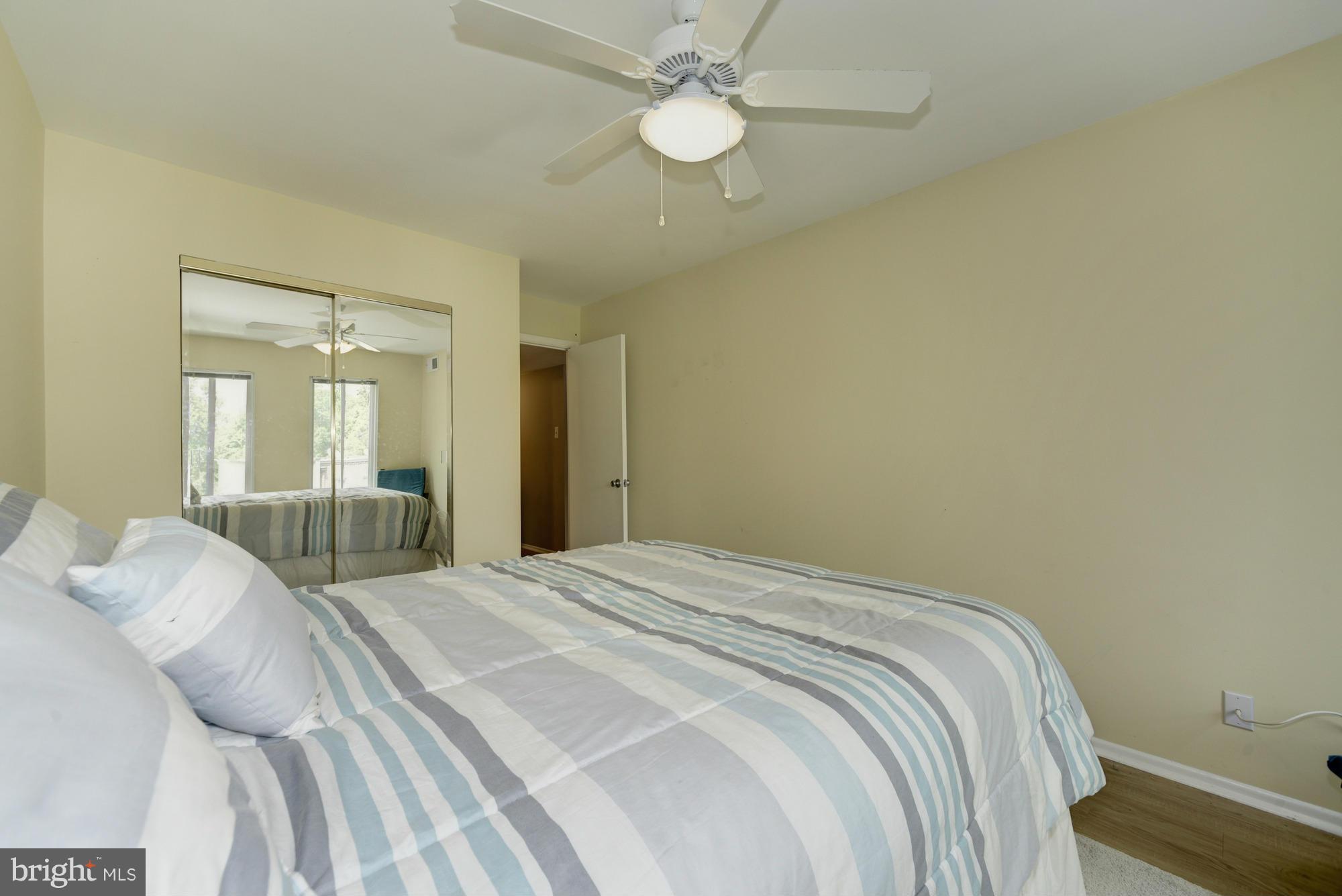 5001 7th Road South, Unit 302 Arlington, VA 22204 - Photo 18 of 30 a bedroom with a bed and a chandelier