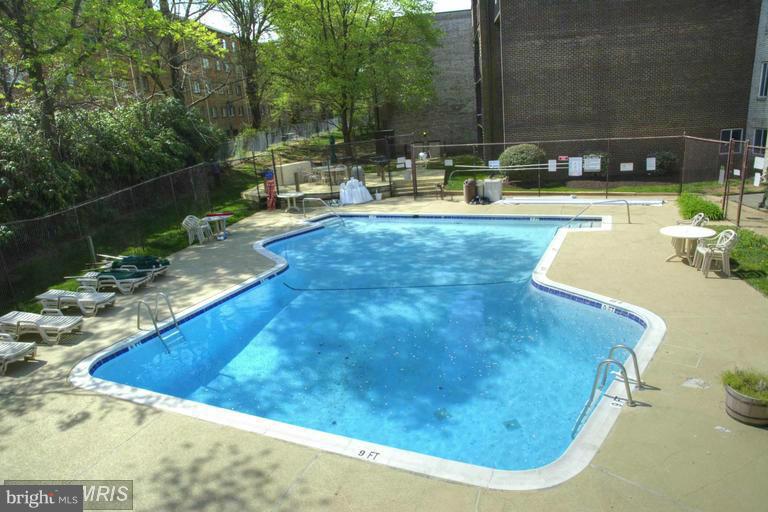 5001 7th Road South, Unit 302 Arlington, VA 22204 - Photo 23 of 30 a view of a swimming pool with a yard and seating