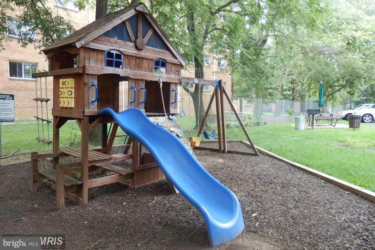 5001 7th Road South, Unit 302 Arlington, VA 22204 - Photo 24 of 30 a view of house with a yard and slide