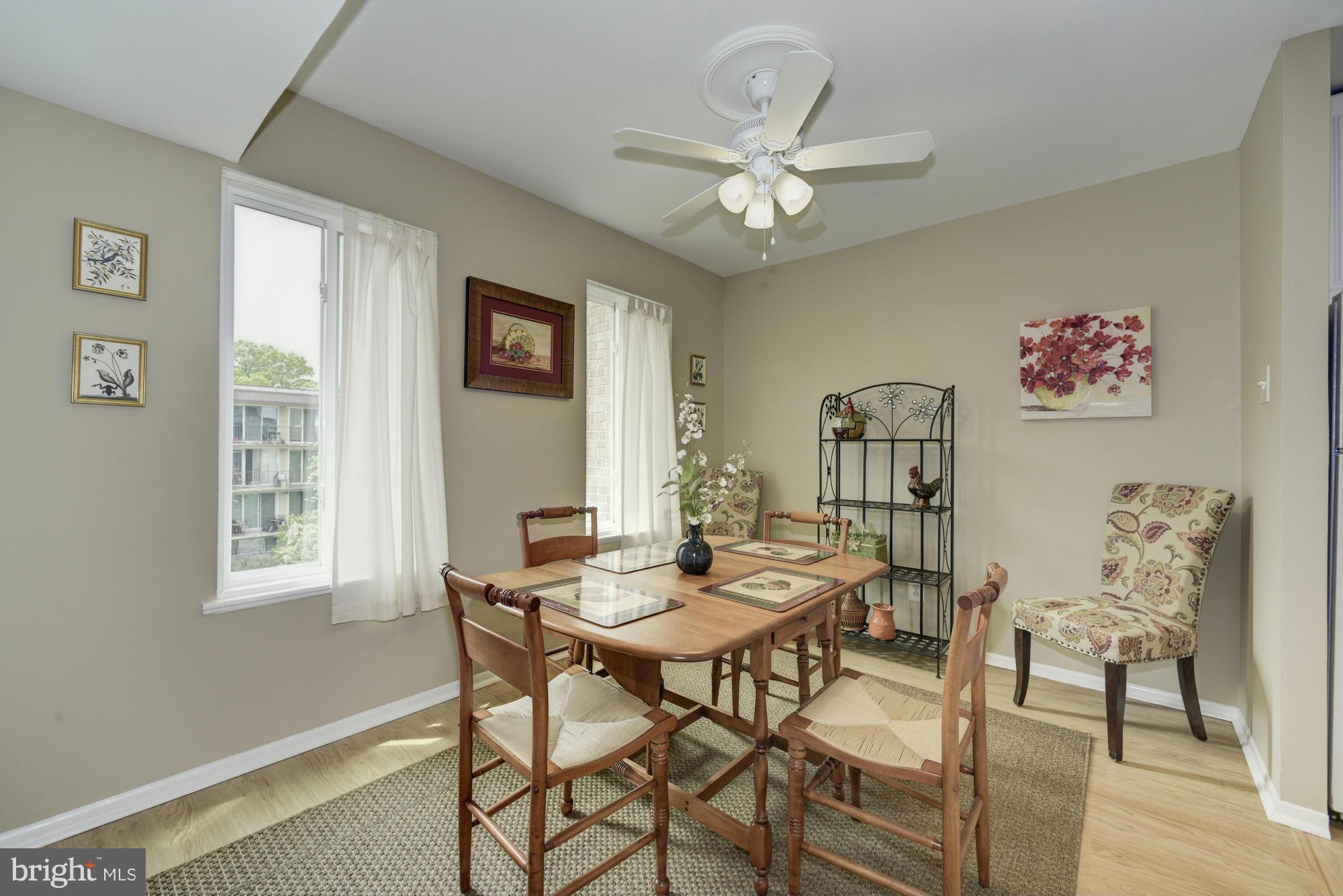 5001 7th Road South, Unit 302 Arlington, VA 22204 - Photo 7 of 30 a view of a dining room with furniture and a chandelier