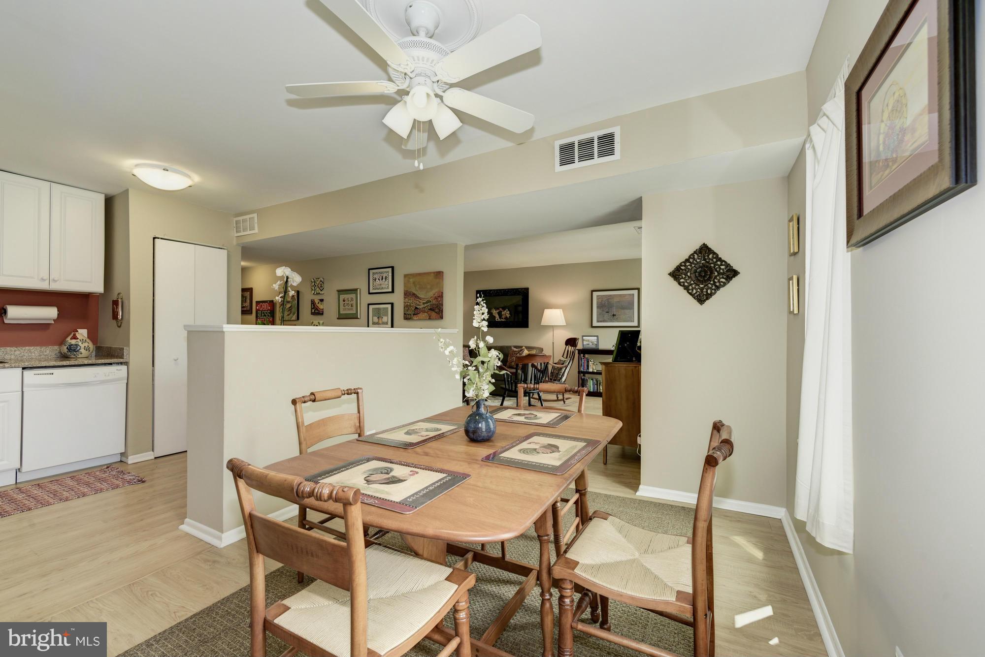 5001 7th Road South, Unit 302 Arlington, VA 22204 - Photo 8 of 30 a view of a dining room with furniture and a chandelier