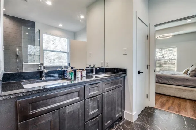 a kitchen with stainless steel appliances a sink stove and cabinets