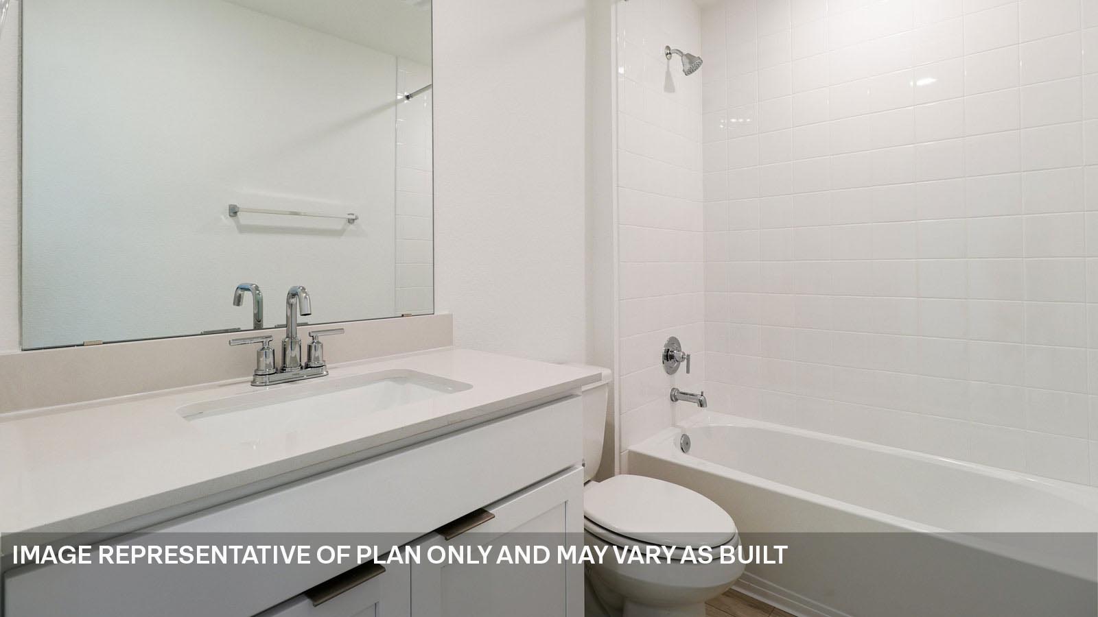 12217 Silverston Tree Bend Buda, TX 78610 - Photo 23 of 24 a bathroom with a sink a toilet and a bathtub