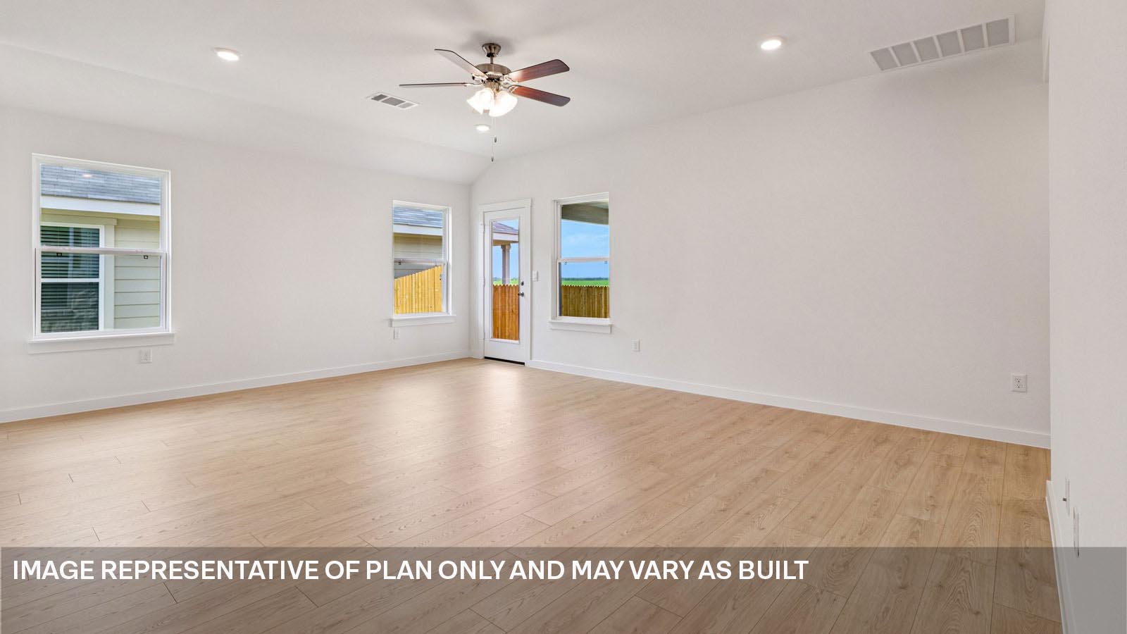 12217 Silverston Tree Bend Buda, TX 78610 - Photo 5 of 24 a view of a room with wooden floor and ceiling fan