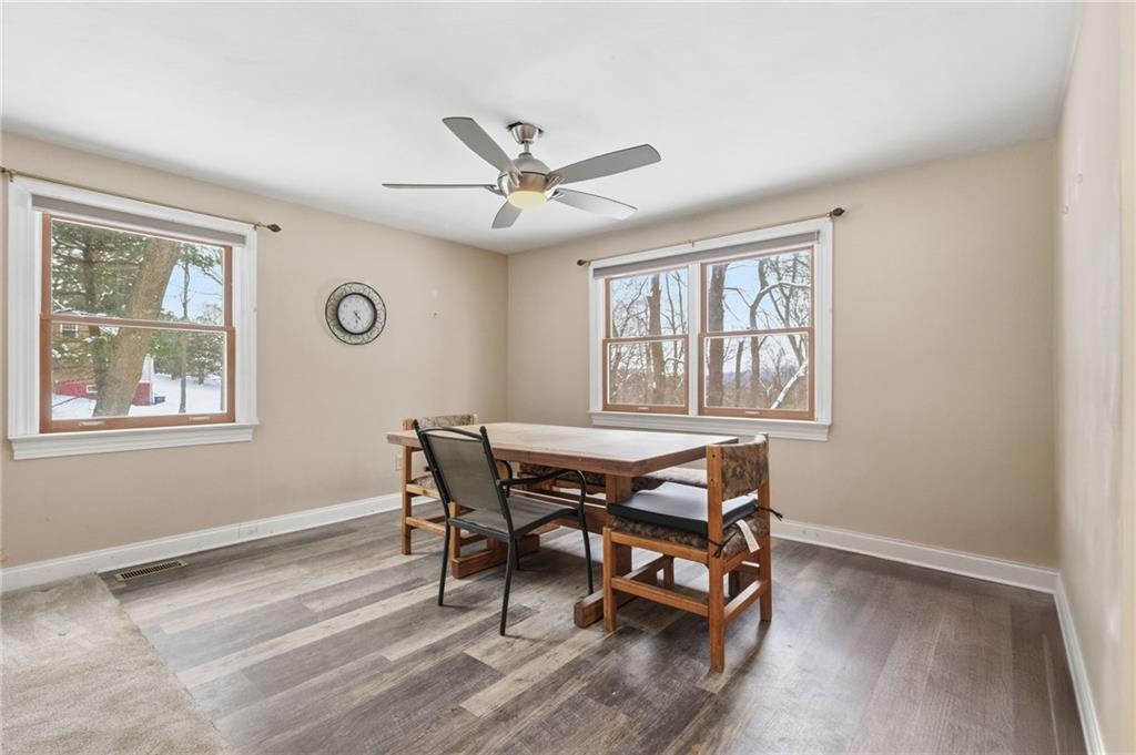 230 Neely School Road Wexford, PA 15090 - Photo 16 of 41 a dining room with a window and a ceiling fan