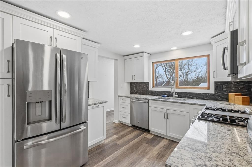 230 Neely School Road Wexford, PA 15090 - Photo 19 of 41 a kitchen with stainless steel appliances granite countertop a refrigerator stove and sink
