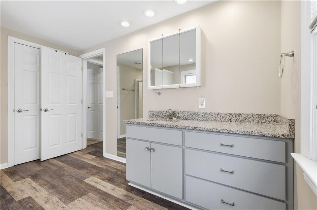 230 Neely School Road Wexford, PA 15090 - Photo 28 of 41 a bathroom with a granite countertop sink and a mirror