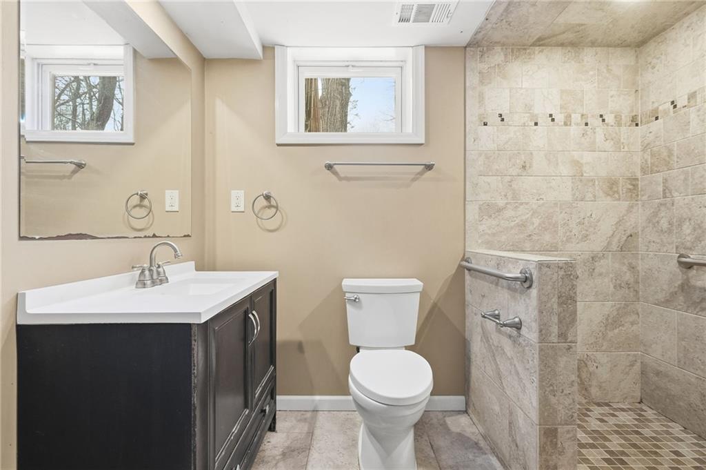 230 Neely School Road Wexford, PA 15090 - Photo 35 of 41 a bathroom with a toilet a sink and mirror