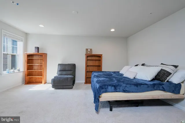 a bedroom with furniture and a window