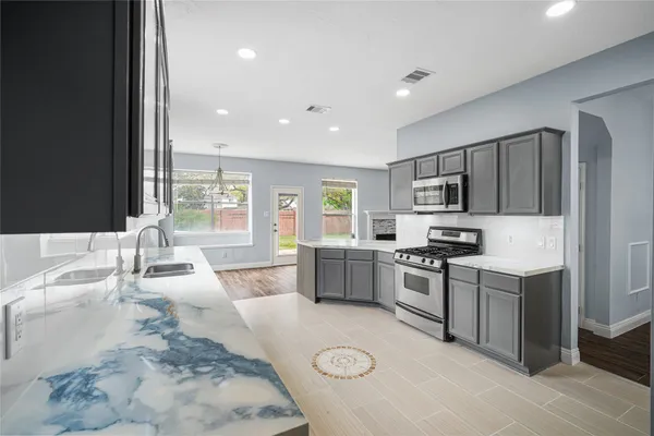 a large kitchen with a large window