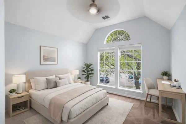 a bedroom with a bed and a chair