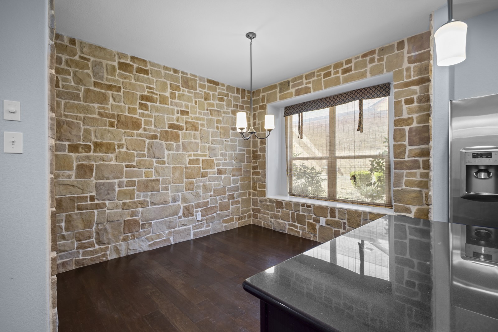 245 Razzmatazz Trail Buda, TX 78610 - Photo 13 of 40 Unfurnished dining area with dark wood finished floors