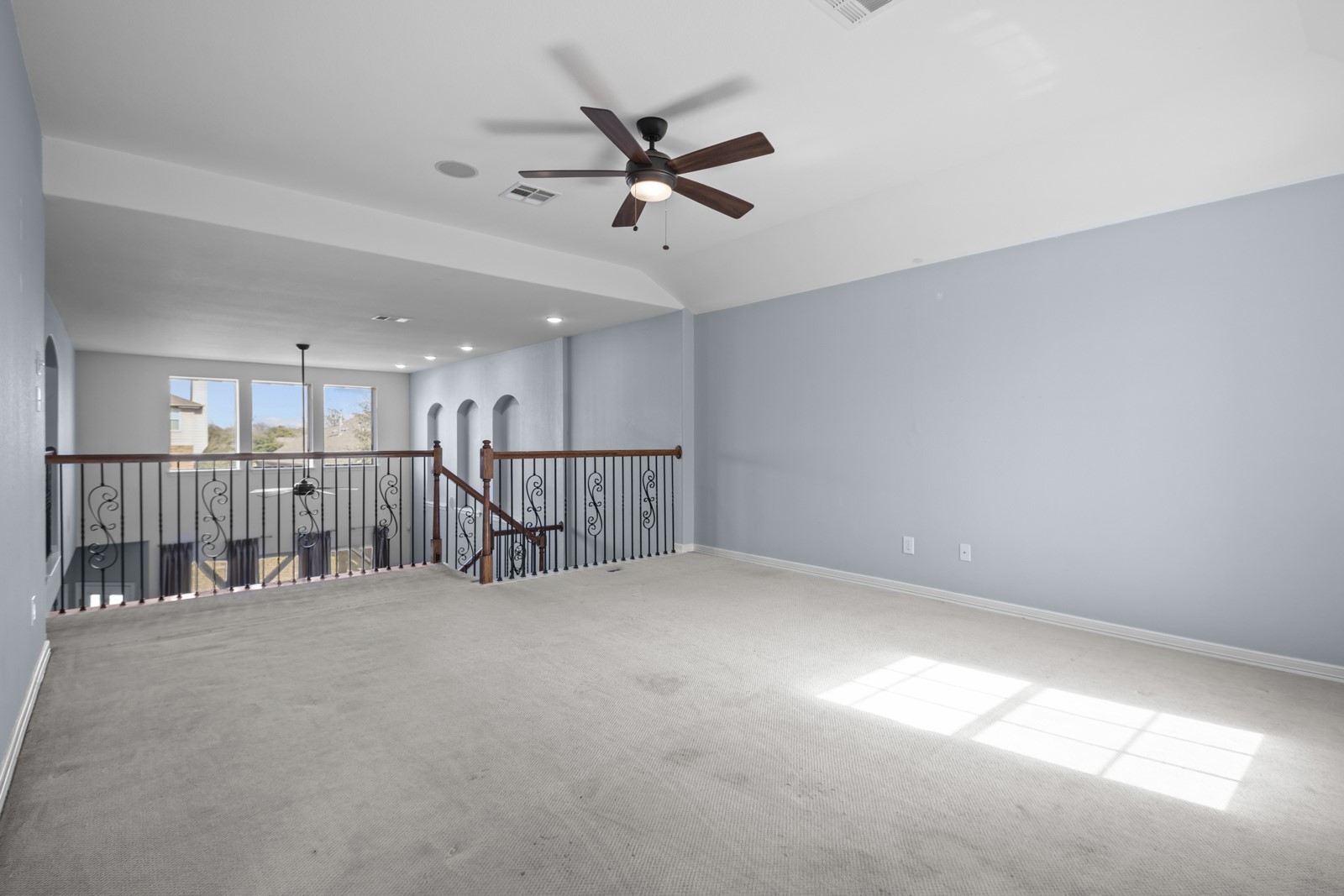 245 Razzmatazz Trail Buda, TX 78610 - Photo 25 of 40 Unfurnished room featuring carpet, ceiling fan, and recessed lighting