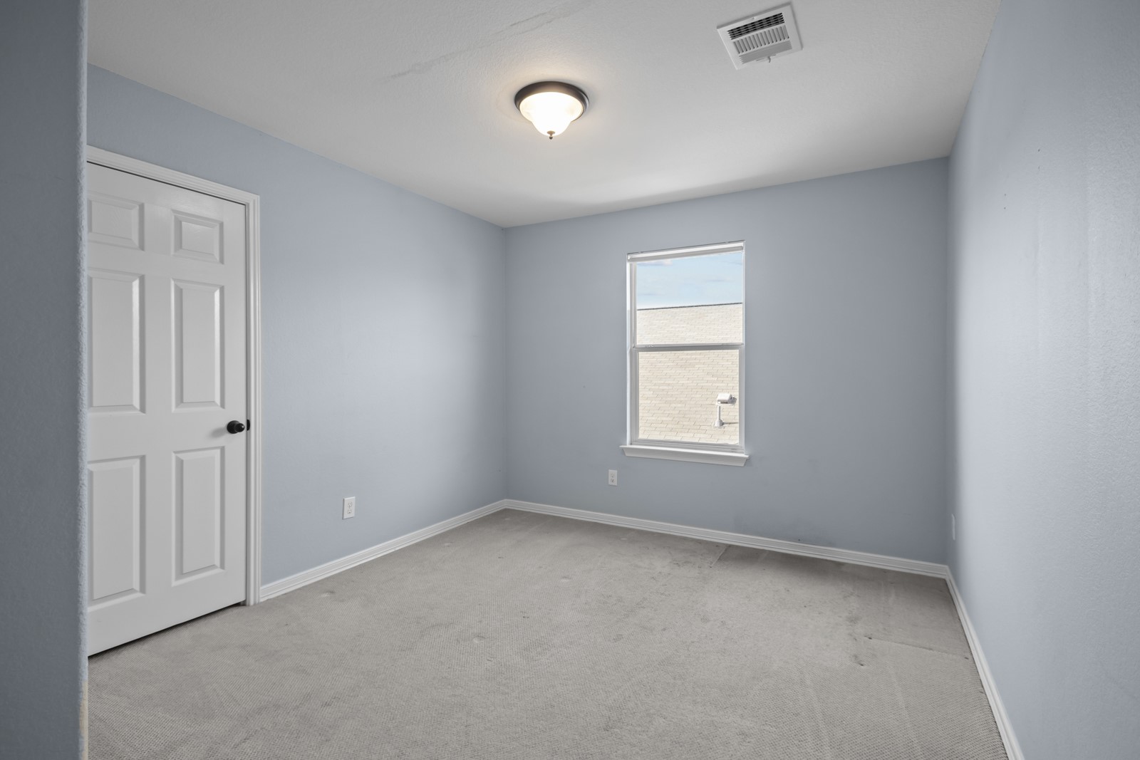 245 Razzmatazz Trail Buda, TX 78610 - Photo 30 of 40 Empty room featuring light colored carpet and baseboards