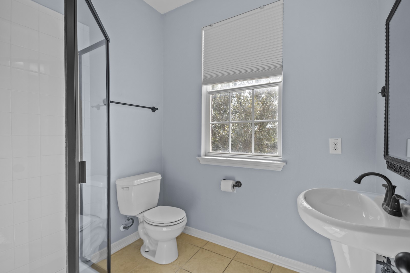 245 Razzmatazz Trail Buda, TX 78610 - Photo 33 of 40 Bathroom with a stall shower and light tile patterned floors