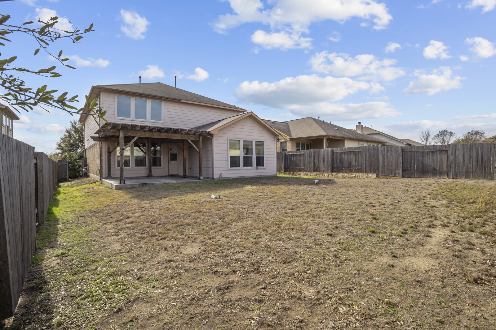 245 Razzmatazz Trail Buda, TX 78610 - Photo 38 of 40 Back of house featuring a patio area and a fenced backyard